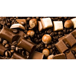 Assorted chocolates and hazelnuts scattered on coffee beans