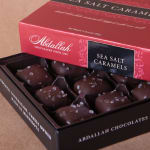 Box of sea salt caramel chocolates in a red and black gift box