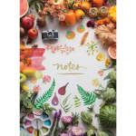 Flat lay of fruit, flowers, and art supplies around a notebook page
