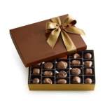 Box of assorted chocolates with a gold ribbon