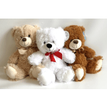 Three plush teddy bears with ribbons sitting together