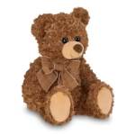 Brown teddy bear with a plaid bow sitting on a white background