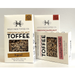 Three boxes of Oregon hazelnut toffee with visible nut pieces