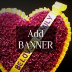 Heart-shaped floral tribute with a yellow border and banner