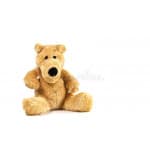 Tan plush teddy bear sitting on a white background