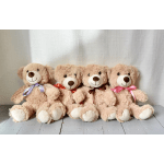 Four plush teddy bears with ribbon bows sitting in a row