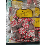Bag of chocolate-covered candies with red and white sprinkles