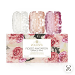 Three rose-scented candles in faceted glass holders with floral packaging