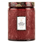 Red decorative candle jar with floral embossed pattern and labeled lid