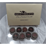 Box of handmade chocolates with eight truffles on a marble surface