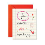 A greeting card with handwritten text and a red envelope