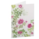 Floral greeting card with pink and green blossoms on a white background