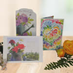Greeting cards with floral designs and a yellow rose arrangement