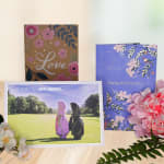 Greeting cards with floral designs and a pink flower arrangement