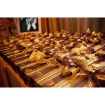 Rows of gold and purple gift boxes tied with ribbon bows
