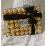 Box of Ferrero Rocher chocolates tied with a black ribbon