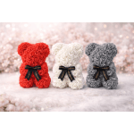 Three rose-covered teddy bears in red, white, and gray with black ribbons