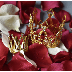 Red and white rose petals with small gold jeweled crowns