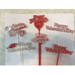 Valentine's Day cake toppers with red and gold lettering