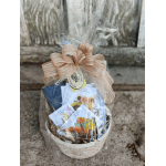 Gift basket with seed packets tied in clear wrap and a tan bow