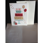 Birthday card with a tiered cake, candles, balloons, and gift boxes