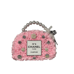 Pink rose-shaped handbag with pearl handle and Chanel-style label