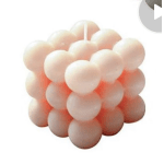 Cluster of pale peach balloons arranged in a cube shape
