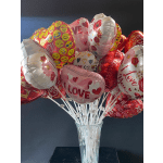 Heart-shaped Valentine balloons in a glass vase