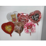 Assorted heart-shaped Valentine balloons with love messages and a teddy bear design