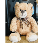 Plush teddy bear with a plaid bow tie