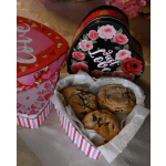 Heart-shaped gift boxes with cookies and pink floral designs