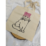 Canvas tote bag with a cat illustration wearing a pink hat