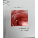 Greeting card with a close-up pink rose and romantic text
