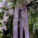 Lavender orchid arrangement with long purple ribbons