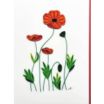 Quilled paper flowers with orange and red petals on a white background