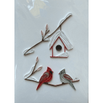 Paper quilled birds on branches around a birdhouse