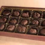 Box of assorted chocolate truffles in paper cups