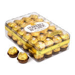 Box of Ferrero Rocher chocolates with two pieces outside the package