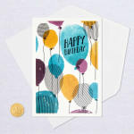 Birthday card with colorful balloon illustrations and matching envelope
