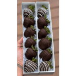 Box of chocolate-covered strawberries with white drizzle