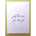 White greeting card with 'just because you are you' text and scattered pastel dashes.