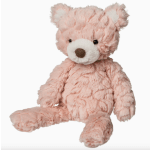 Pink plush teddy bear with a white snout and brown nose