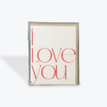 Greeting card with red text reading "i love you"