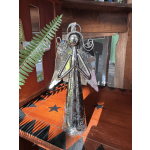 Silver angel figurine with decorative cutout wings