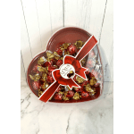 Heart-shaped box of wrapped chocolates with a red ribbon