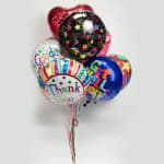 Cluster of colorful congratulatory and thank-you balloons with ribbons