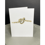 White gift bag with a gold rope knot design