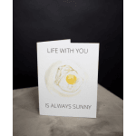 Greeting card with a fried egg illustration and the text "LIFE WITH YOU IS ALWAYS SUNNY"
