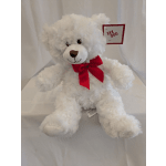 White teddy bear with a red bow and gift tag