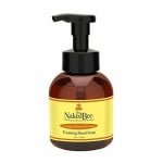 Bottle of foaming hand soap with a black pump and yellow label